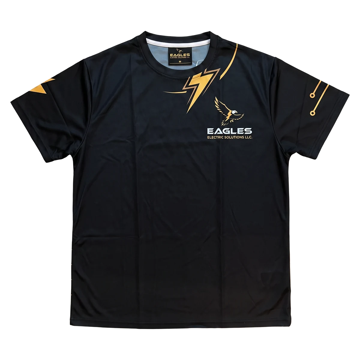 Black work shirt with an eagle logo for an electrical services company